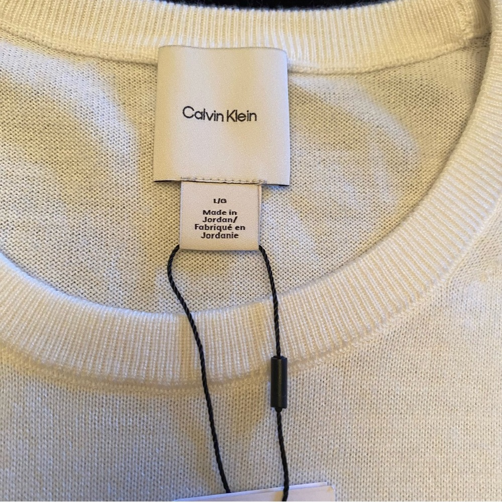 Calvin Klein Men's Off-White Crewneck Sweater. Price reflects slight defects